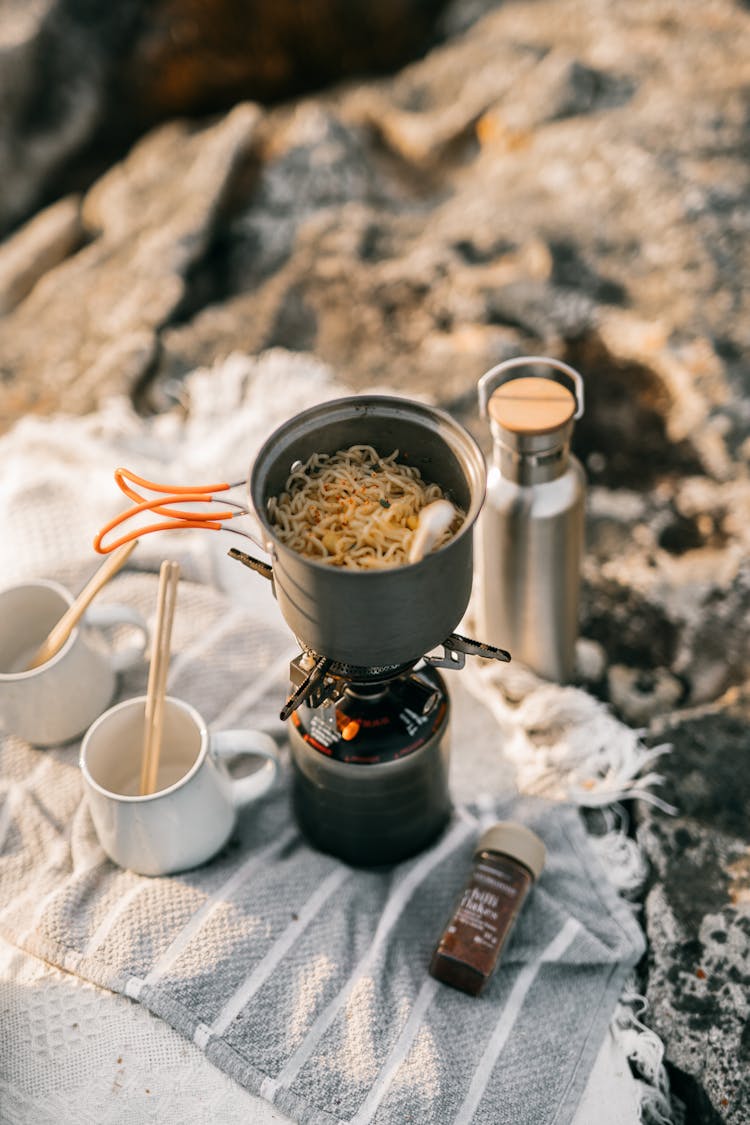 Cooking Pot With Noodles On A Burning Stove