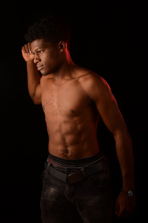 Shirtless Man in Black Denim Jeans