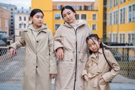 2 Women in Gray Coat Standing on Sidewalk