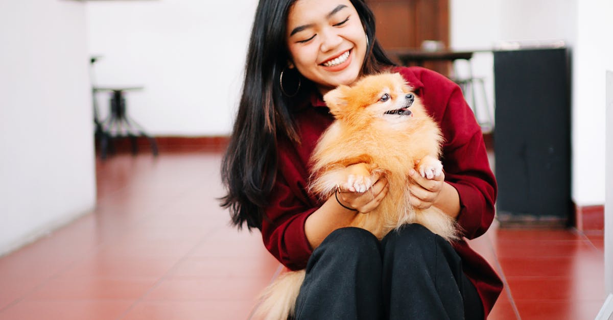 A Woman Petting Her Pomeranian Dog