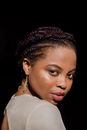 Woman in White Shirt Wearing Gold Earrings