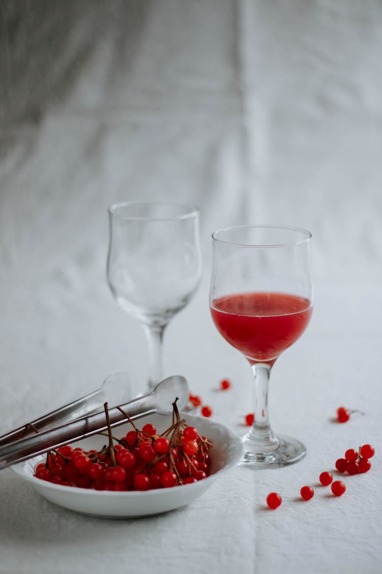 Cranberry Juice In Glass On White Background