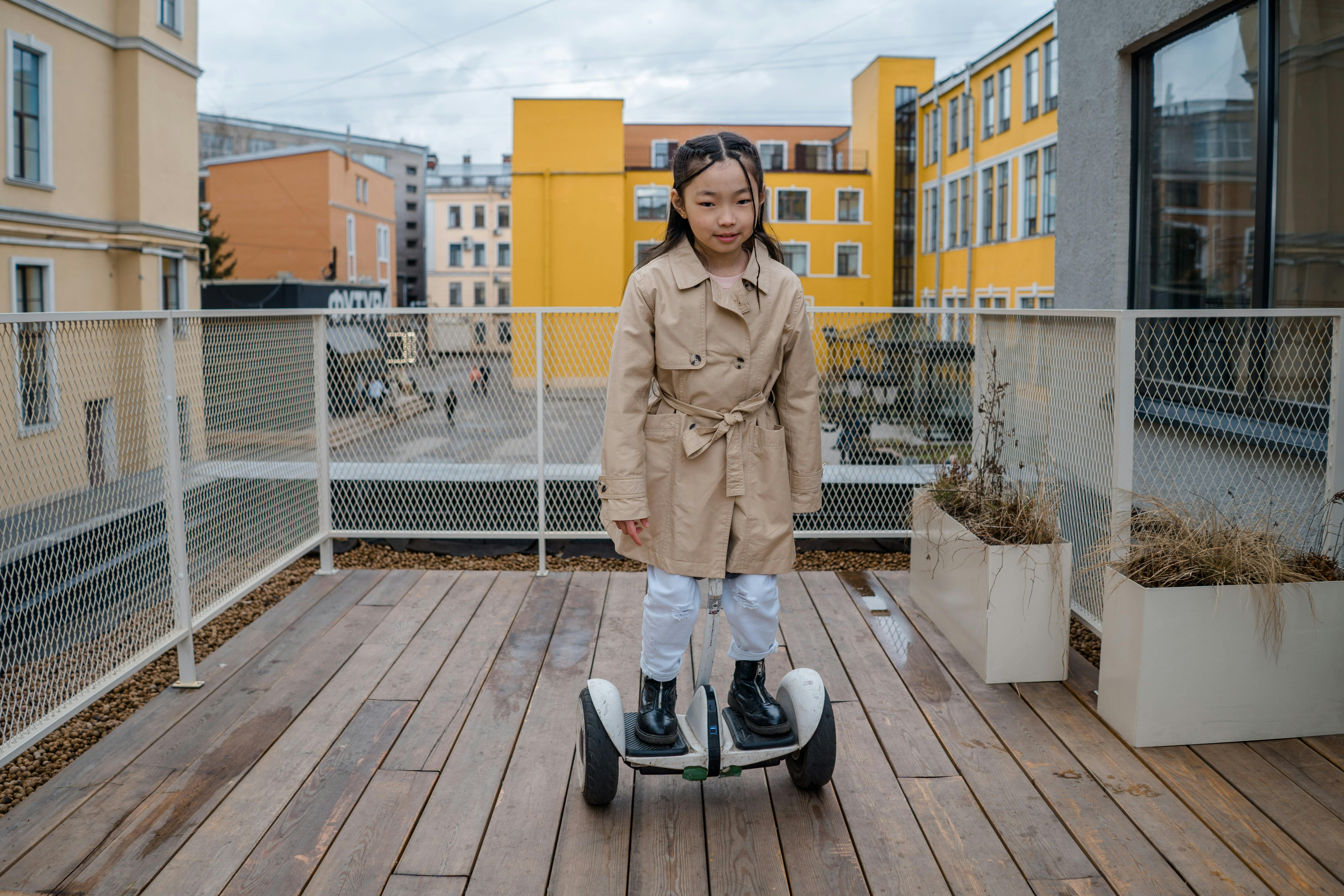 a girl riding a hoverboard