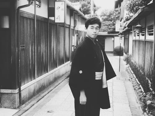 Monochrome Photo of a Man in a Yukata Looking at the Camera