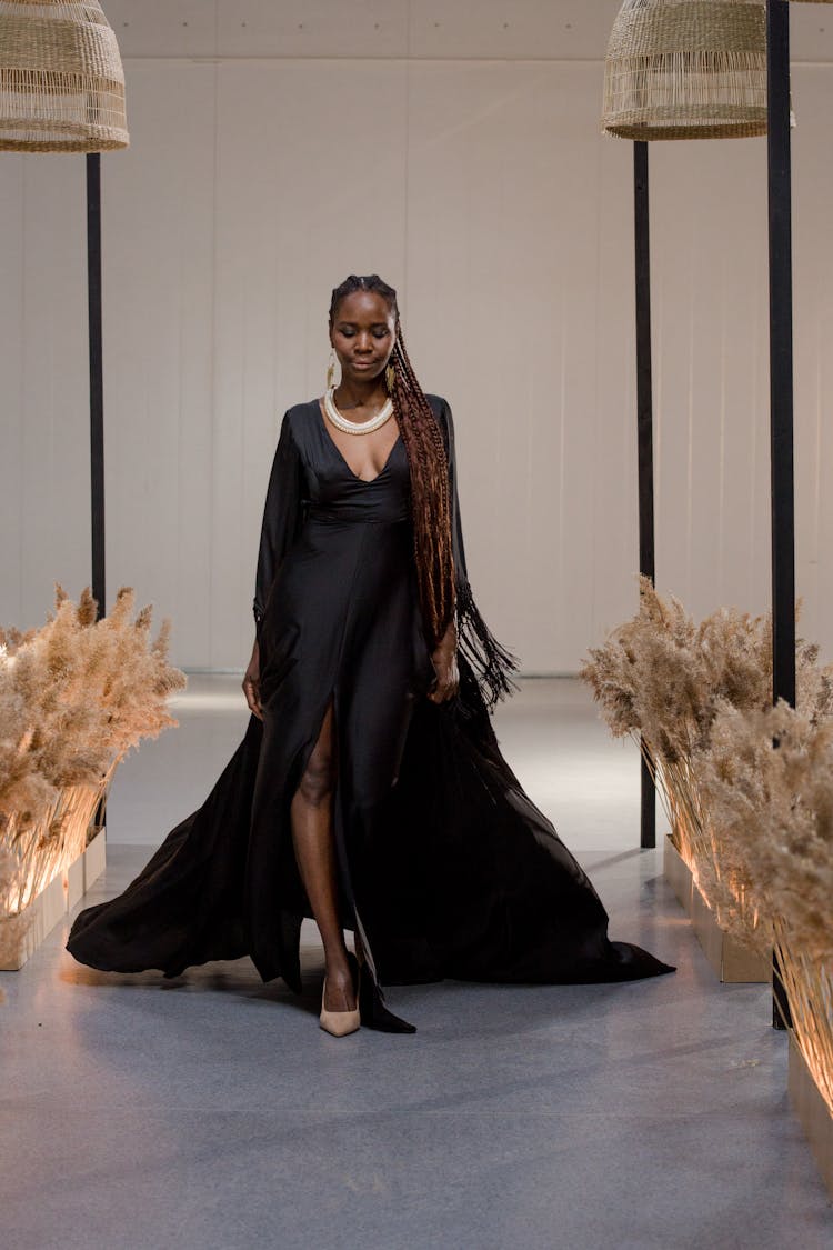 Woman Wearing Her Black Gown During The Fashion Show