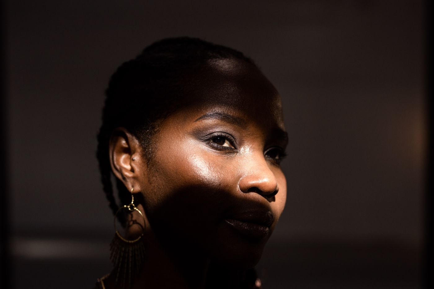 Close-up cinematic portrait with dramatic side lighting. Photo by cottonbro studio on Pexels