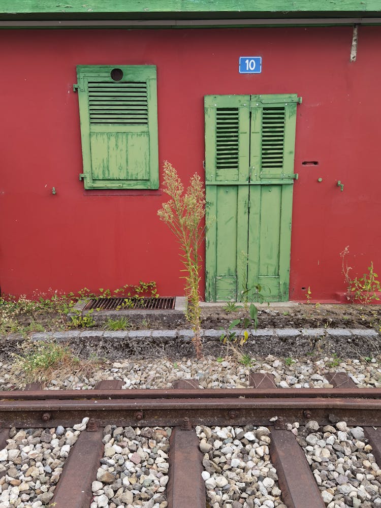 Colorful Building Near Railway Tracks