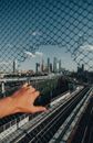 Person Holding on Black Metal Fence
