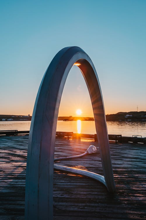 Sunset over Pier on Sea Shore