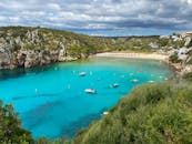 An Aerial Photography of a Beach Between Mountains