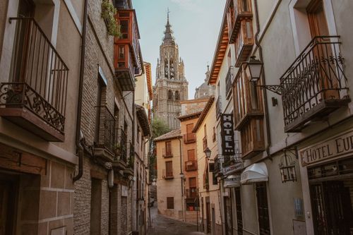 Free Charming street view of Toledo with its iconic cathedral in the background. Stock Photo