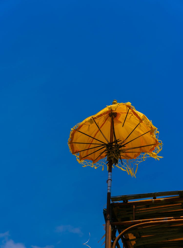 Traditional Ceremonial Yellow Umbrella Attached To The Roof 