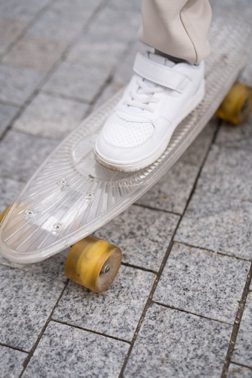 A Person Stepping on a Skateboard