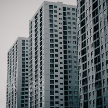Monochrome image of modern skyscrapers showcasing urban architecture in daylight.