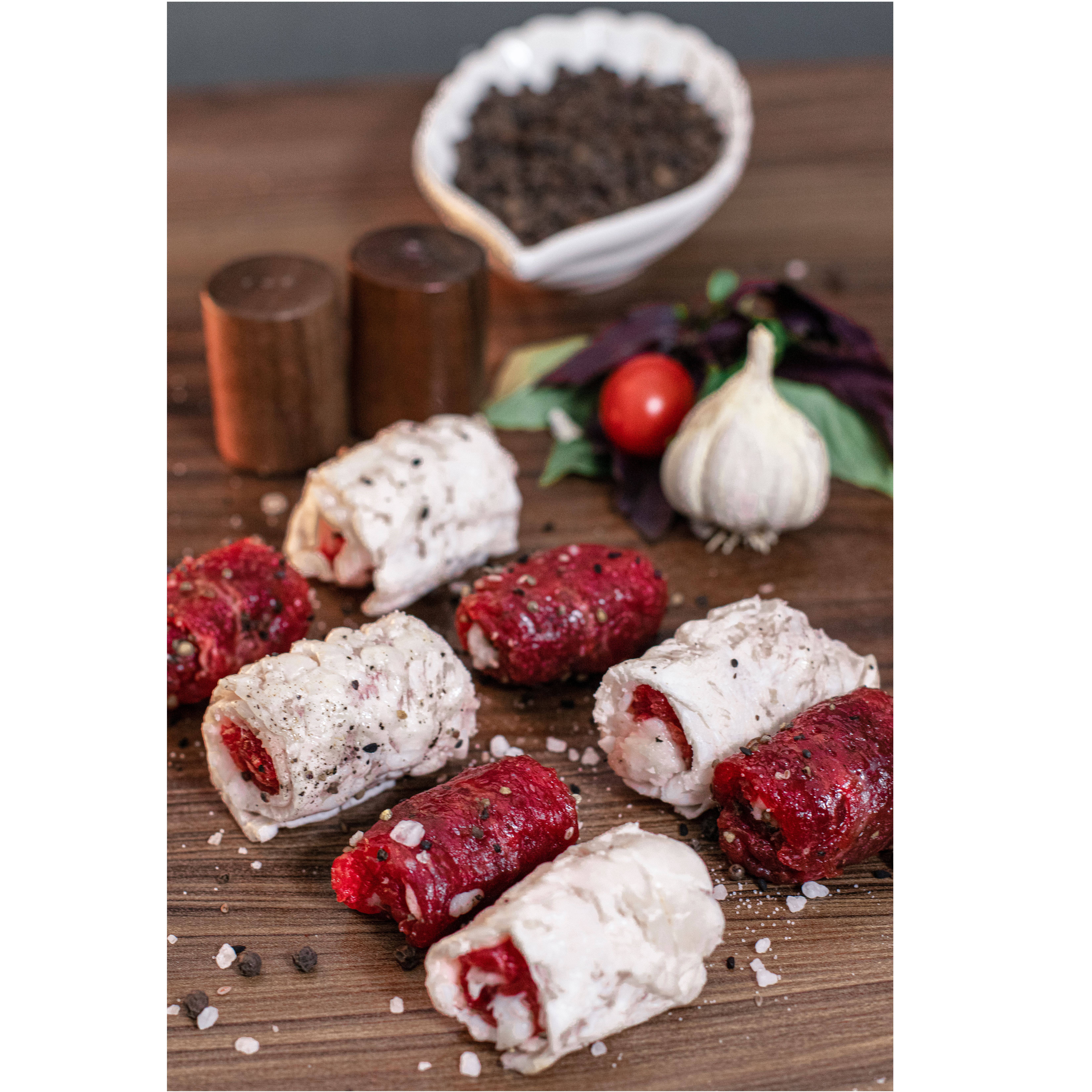 Delicious raw Persian meat rolls seasoned with garlic, herbs, and spices.