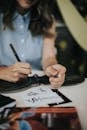 Architect drawing on a Black Paper in Tilt Shift Lens