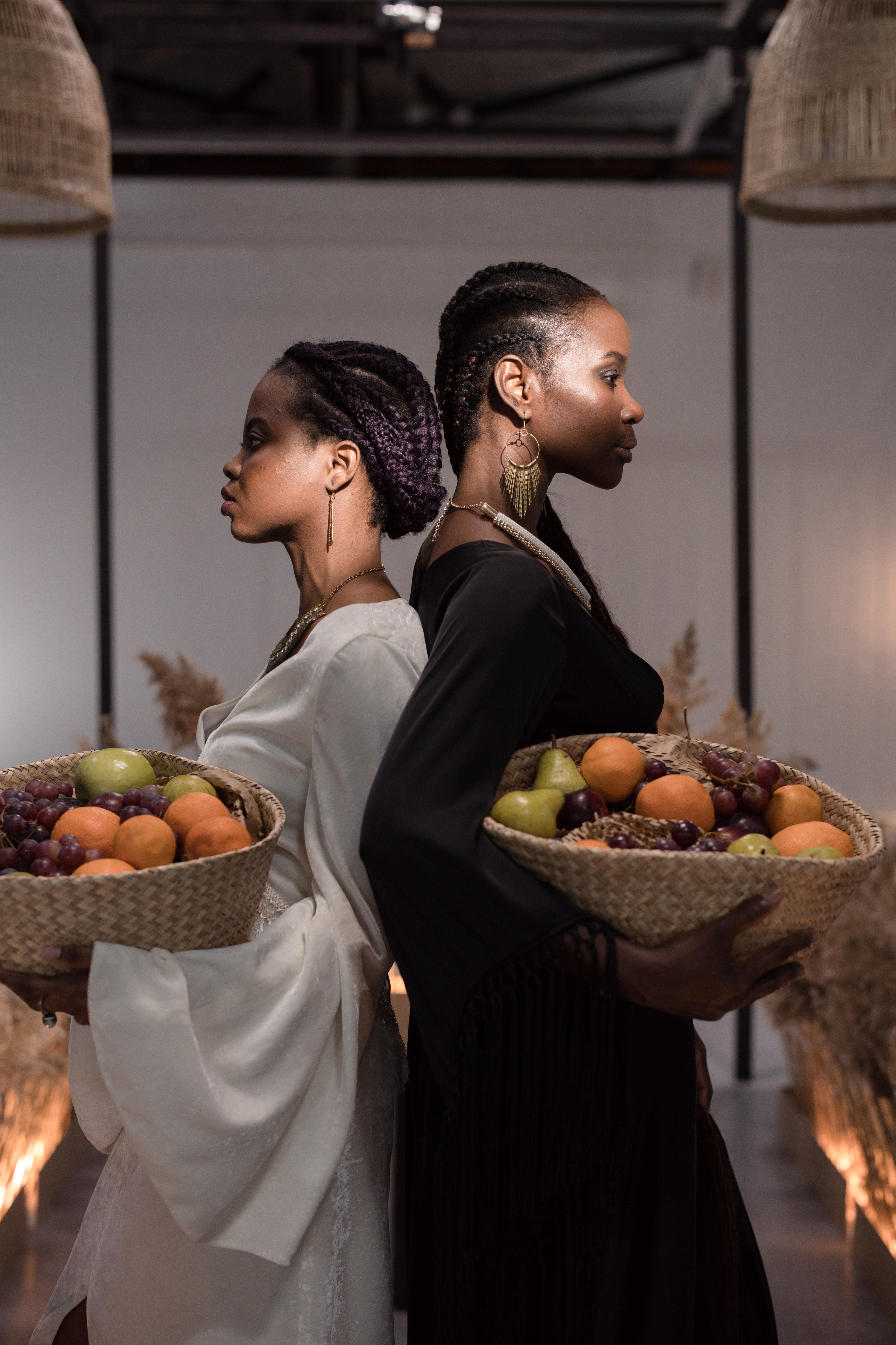 Women Holding Fruits in a Basket · Free Stock Photo