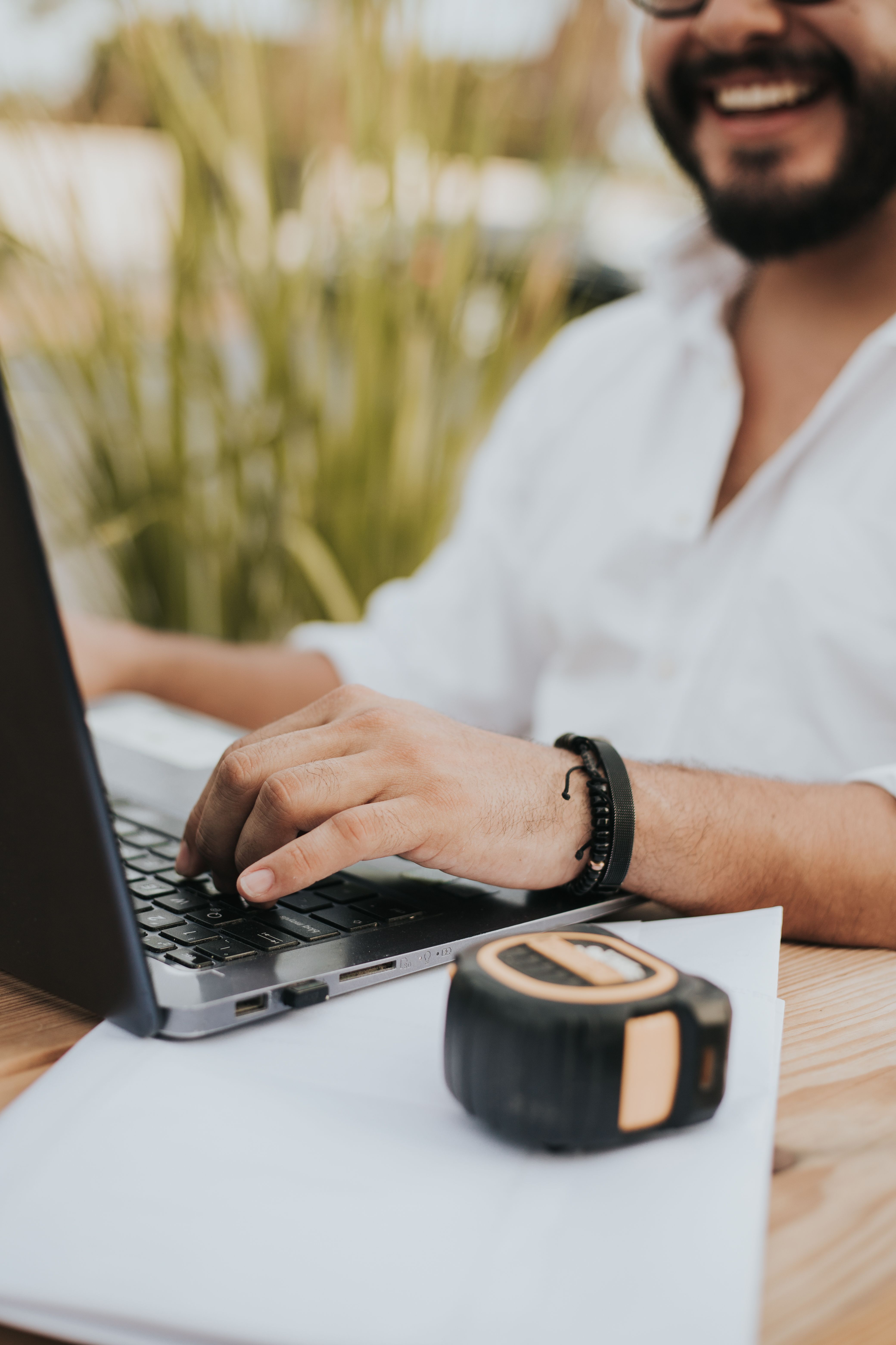 Person in White Dress Shirt Using Black Laptop Computer