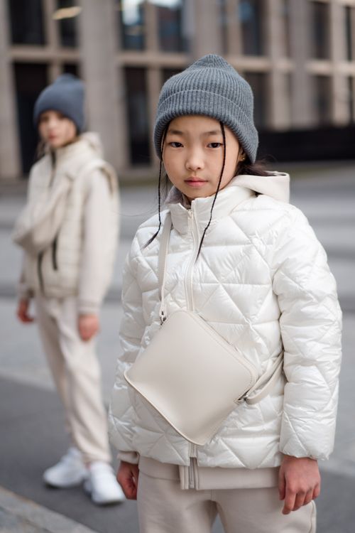 Free Two young girls in fashionable winter wear, showcasing urban style. Stock Photo