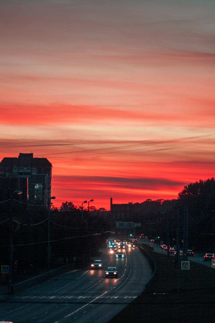 Cars Driving City Highway On Sunset