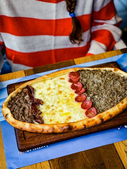 Pizza Served on a Wooden Board