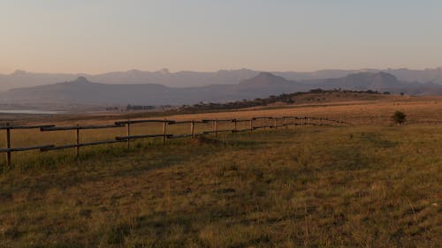 Wooden Fence on a Grass Field