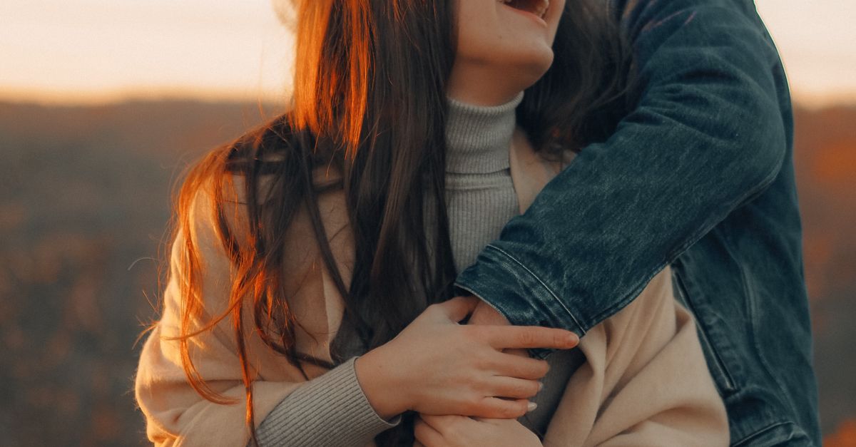 Hugging Coat Woman in Gray Coat Hugging Woman in Gray Coat · Free Stock Photo