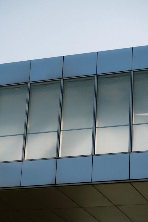 Gray Concrete Building with Glass Windows 