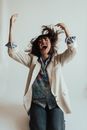 Woman in White Coat and Blue Denim Shorts
