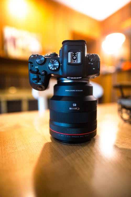 A Camera on a Wooden Surface 