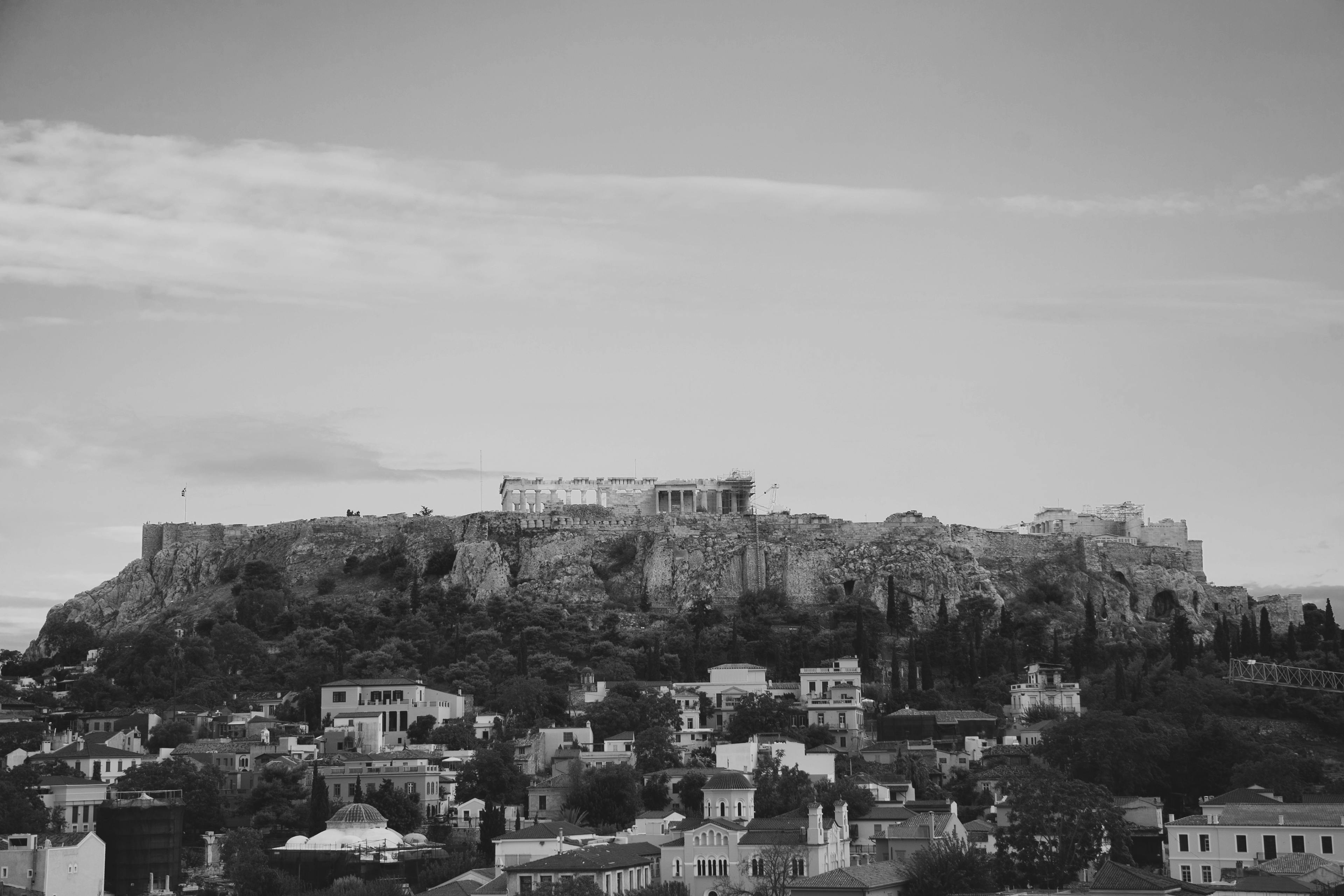 grayscale photo of city buildings