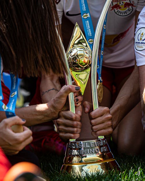 Free People Holding a Trophy Together Stock Photo
