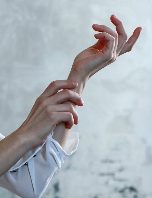 Person in White Long-sleeve Shirt With Both Hands Photo