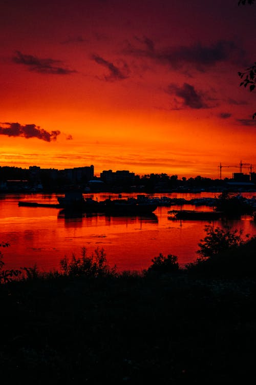 A Silhouette of a Body of Water During Golden Hour