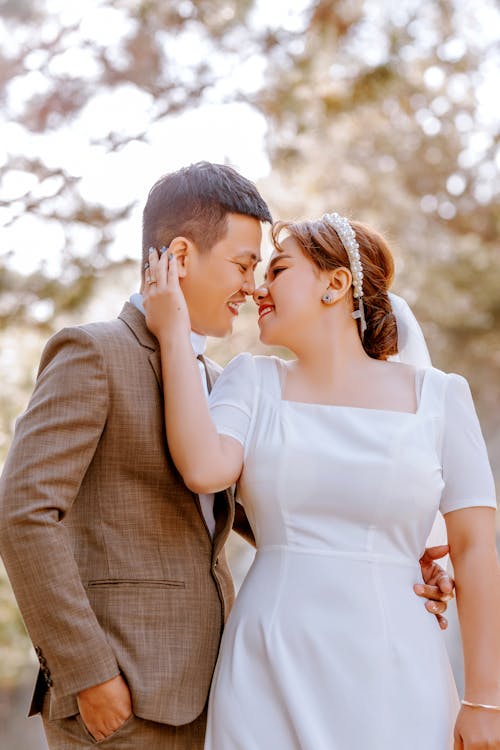 A Bride and a Groom About To Kiss