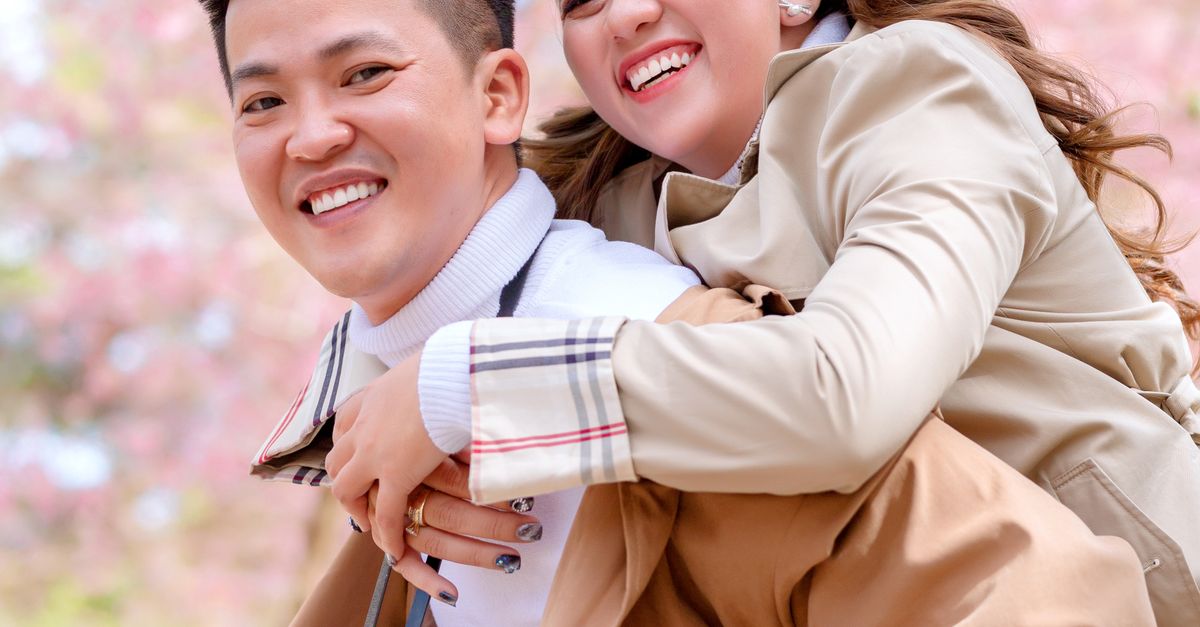 Hugging Coat Man in Brown Coat Hugging Woman in Brown Coat · Free Stock Photo