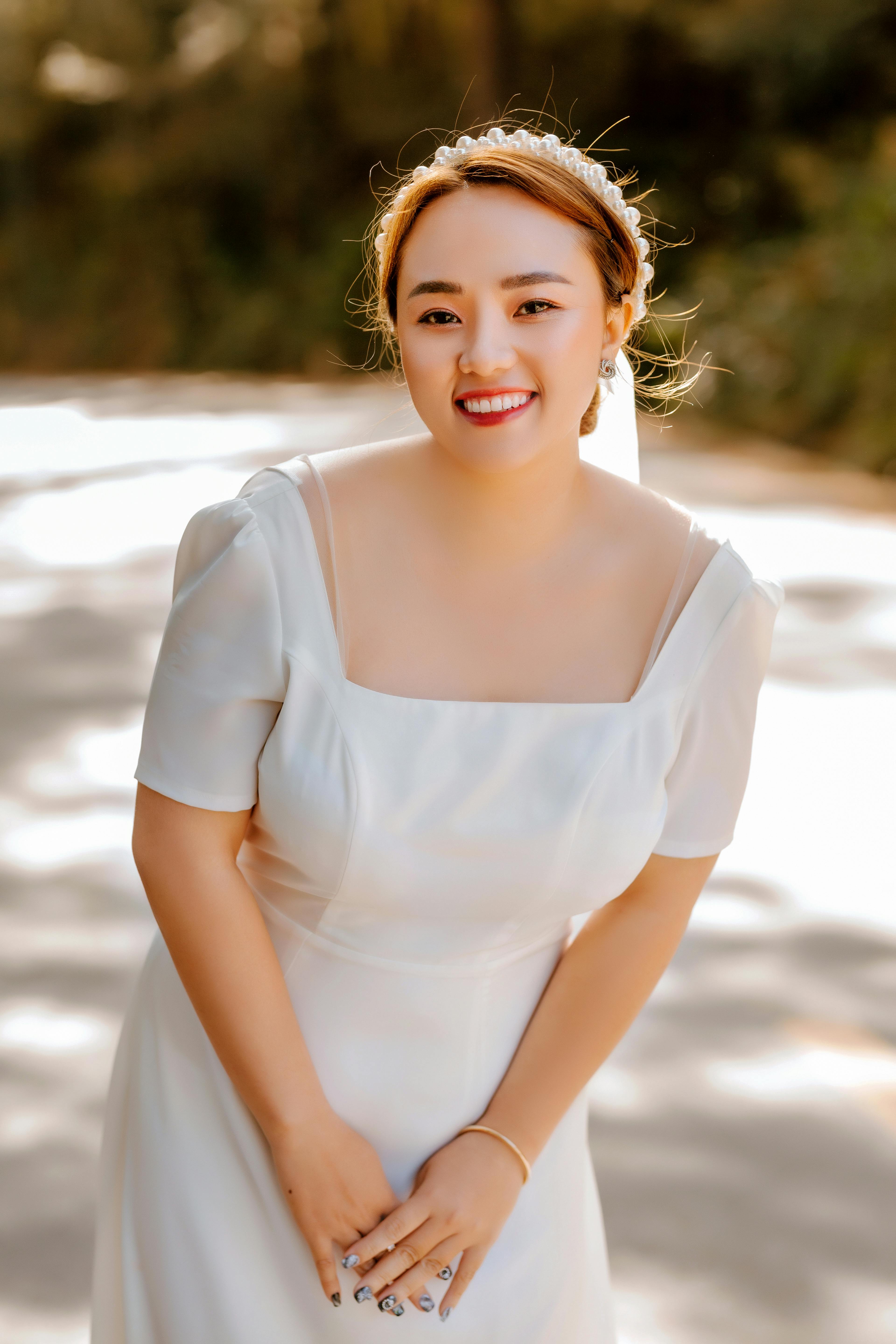 woman in white off shoulder dress