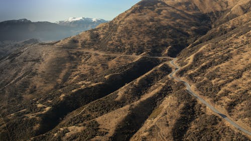 Free Aerial Shot of a the Curvy Mountain Road Stock Photo