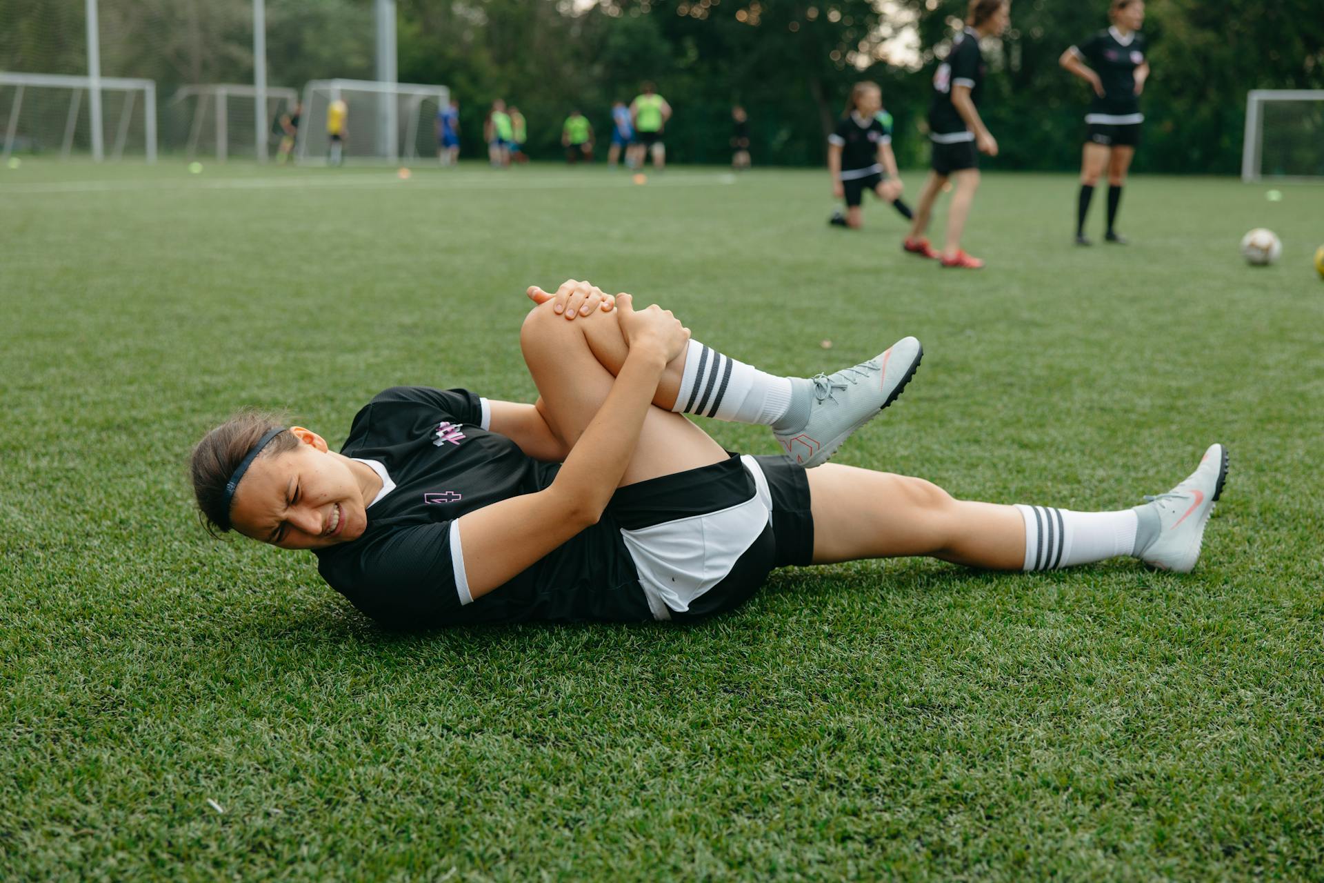 Injured Athlete Lying on a Soccer Field