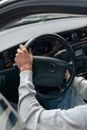 Person in Gray Long Sleeve Shirt Driving Car