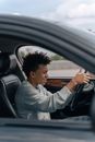 Man in Gray Hoodie Driving Car