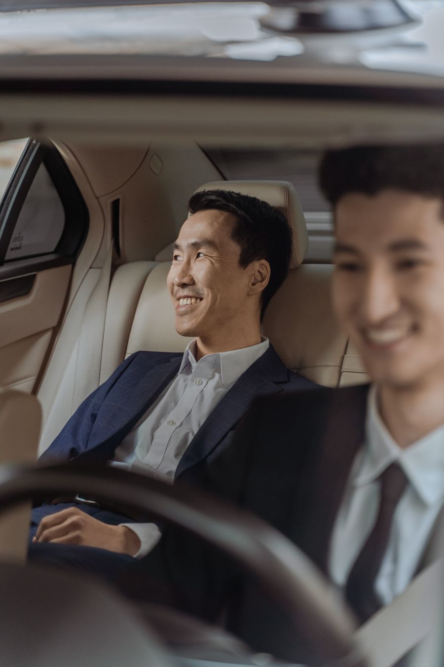 Business passengers travelling in an executive car