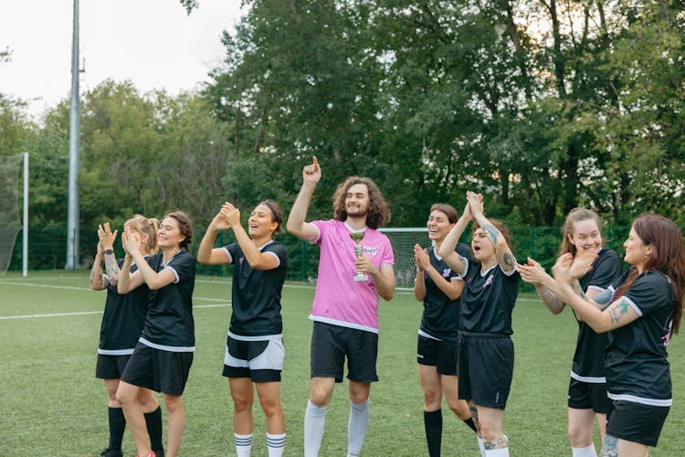 A Group Of Athletes Celebrating