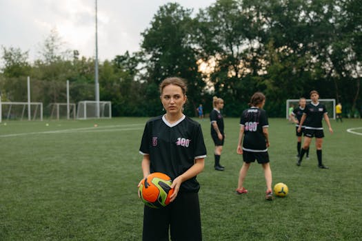 Women soccer team practicing on an outdoor field, ready for a match.