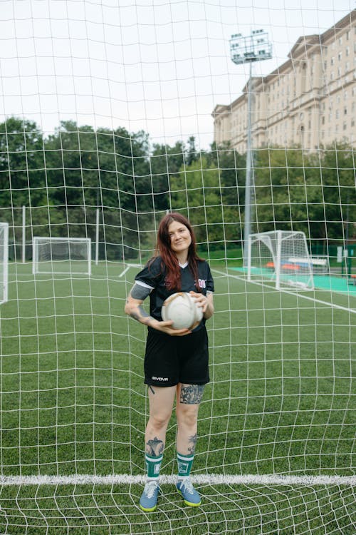 Woman Holding a Soccer Ball