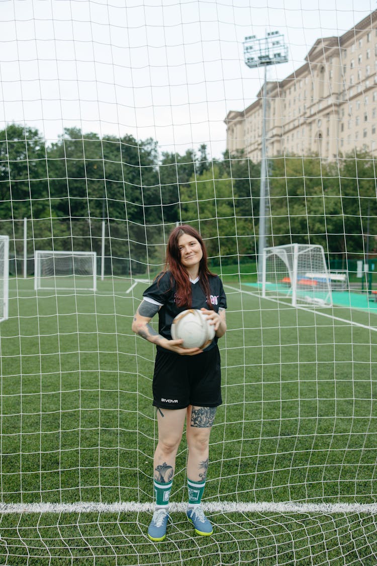 Woman Holding A Soccer Ball