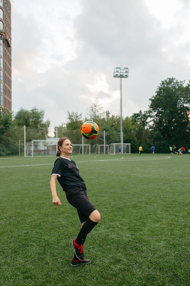 Woman Playing With Soccer Ball