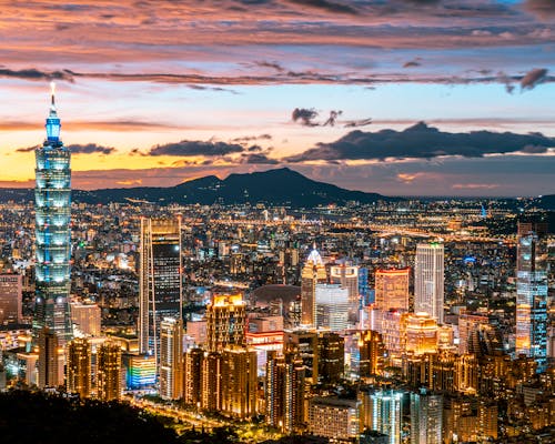 Aerial View of City Buildings and Taipei 101 during Night Time