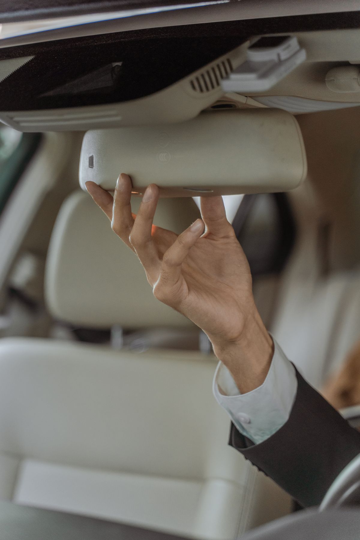 Driver preparing the vehicle for a passenger