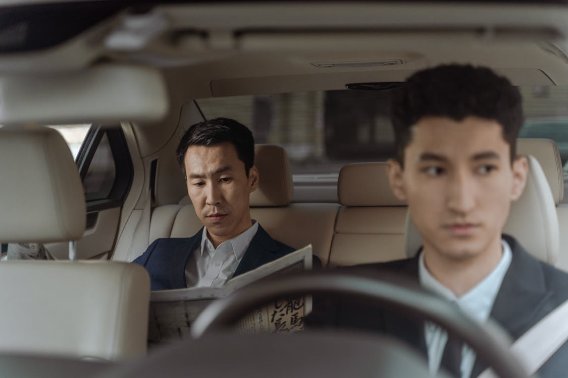 Free 2 Men in White Suit Sitting Inside Car Stock Photo